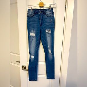 Skinny jeans with rips by Bebe